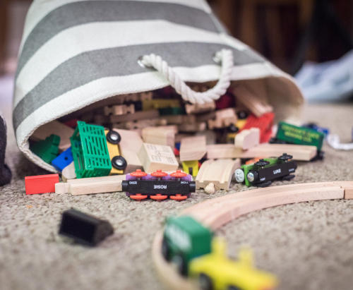 The wooden train basket in the playroom